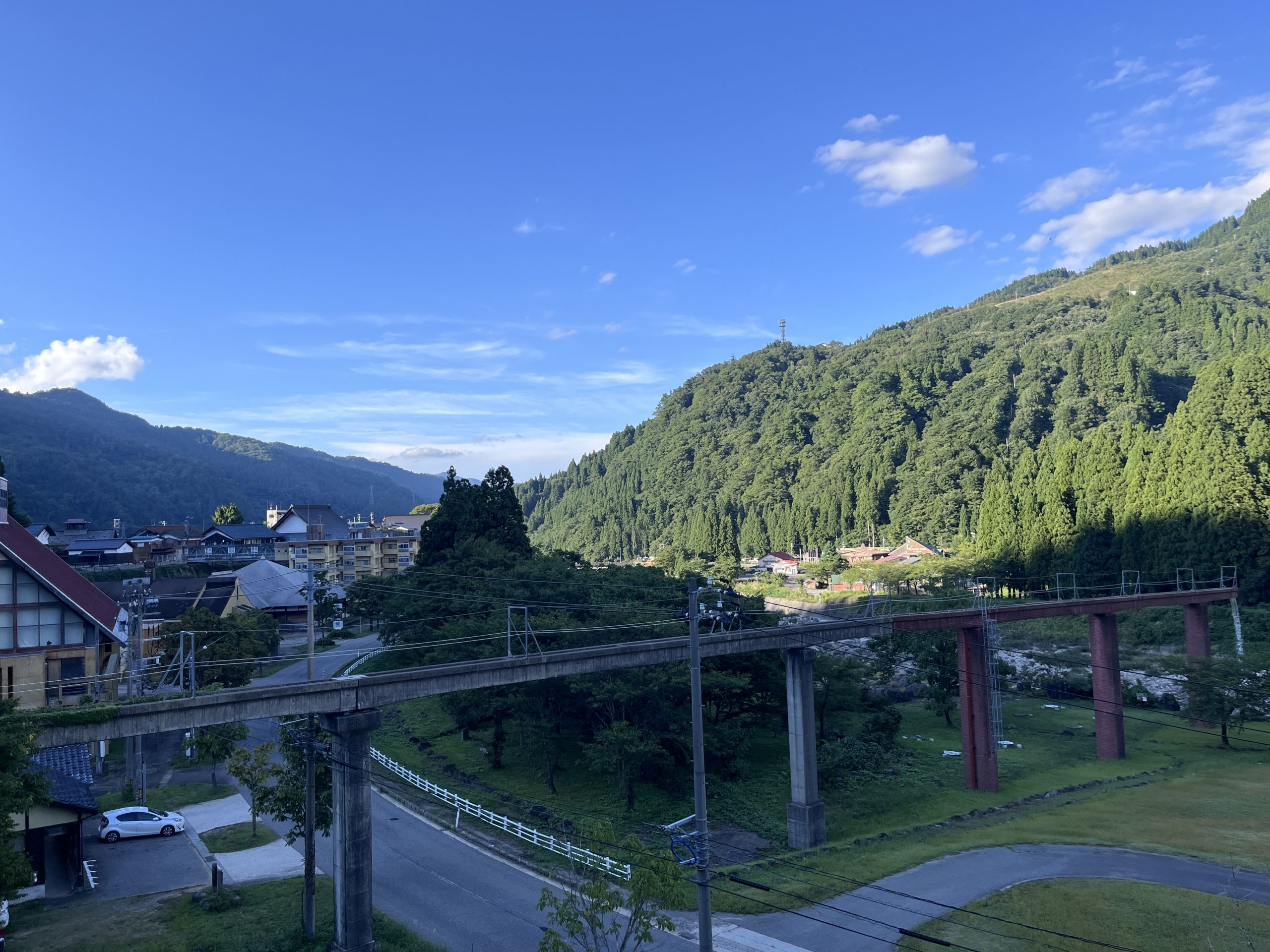 Scenic view of Shiramine village with mountains and river